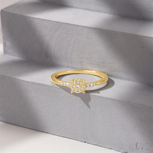Macro shot of S925 sterling silver stamp on golden flower diamond ring band