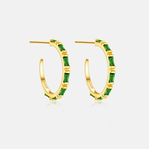 Detail view of gold-plated S925 silver hoop earrings with rectangular green zircons