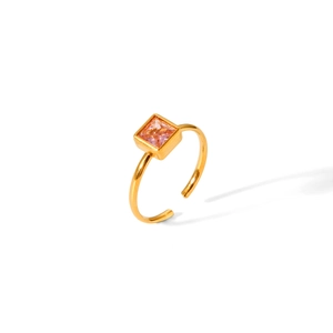 Macro detail of adjustable gold titanium steel ring featuring a square pink zircon stone