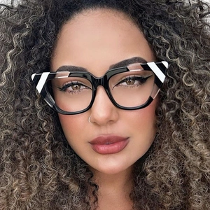 Close-up of black and white striped cat-eye glasses frame on model for a trendy look