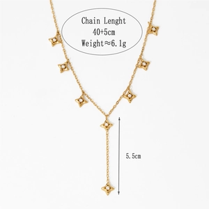 Detail view of gold Y-shaped star necklace with dimensions and weight measurements