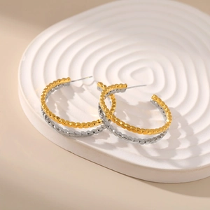 Two-tone C-shape hoop earrings with hammered honeycomb texture in gold and silver