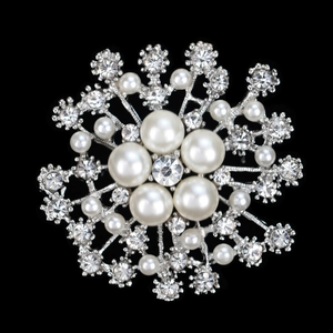 Elegant silver snowflake brooch featuring white faux pearls and sparkling rhinestones