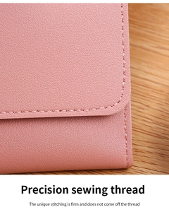 Detail shot of pink lychee leather wallet featuring precision stitching and smooth edges