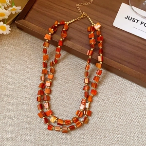 Double-layer ethnic style necklace with orange square shell beads and gold accents