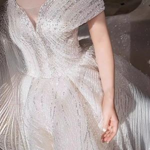 Starry luxury off-shoulder wedding dress with heavy sequin embroidery and a deep V-neckline