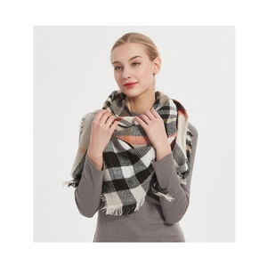 Detail shot of soft black white and orange plaid scarf with fringe on model's neck