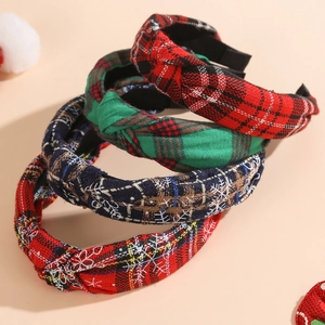 Set of four Christmas knot headbands featuring festive red and green plaid with snowflake patterns