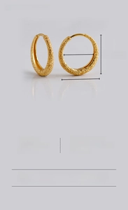 Macro shot of S925 sterling silver hoop earrings with sandblasted frosted texture in gold
