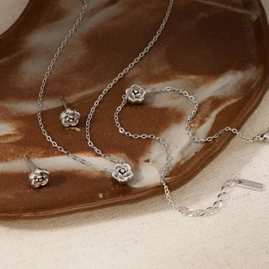 Elegant stainless steel camellia jewelry set with necklace bracelet and earrings