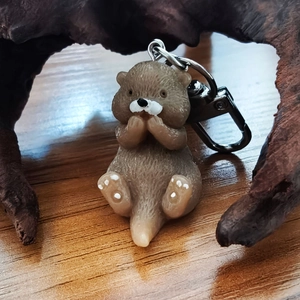 Creative resin beaver keychain animal bag charm with metal ring on natural wood background