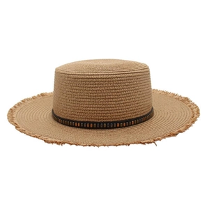 Detailed view of raffia sun hat with beaded ribbon and fringe raw edges