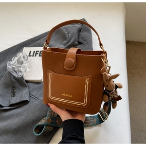 Brown PU leather bucket bag with floral wide strap and cute rabbit charm for women