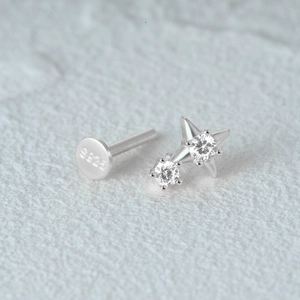 Macro shot of S925 hallmark on a silver cartilage stud earring with cubic zirconia stones