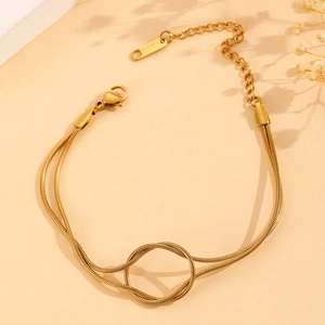 Golden double-layered snake chain bracelet with center knot design and adjustable clasp