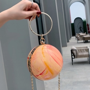 Mini spherical marble resin evening bag with rhinestone handle and gold chain strap