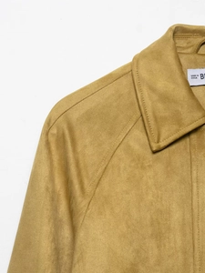 Detail of camel faux suede jacket collar and shoulder with high-quality stitching