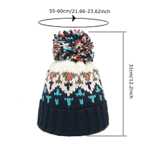 Women's winter knit beanie with colorful pom pom and geometric jacquard pattern