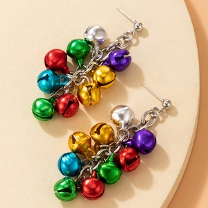 Close-up of festive Christmas drop earrings with colorful bells on silver chains