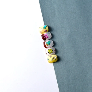 Macro detail of 5D resin nail art charms featuring colorful ice cream and candy patterns