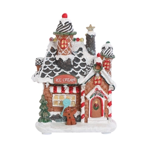 Detail of LED Christmas ice cream gingerbread house with faux snow and resin texture
