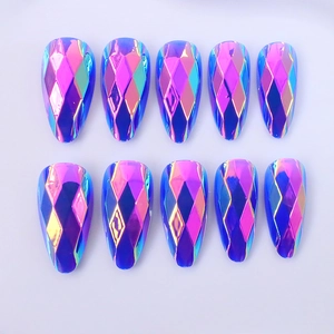 Detail of almond-shaped press-on nails with 3D geometric facets and iridescent finish