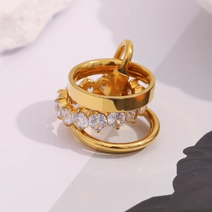 Macro shot of 18K gold plated stainless steel tiered rings with sparkling zircon inlay
