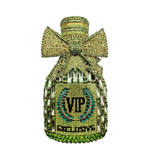 Detailed view of luxury green crystal bottle clutch with VIP rhinestone embellishments