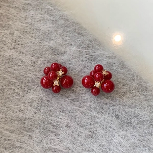 Elegant gold-plated red resin berry fireworks earrings with sparkling zircon accents