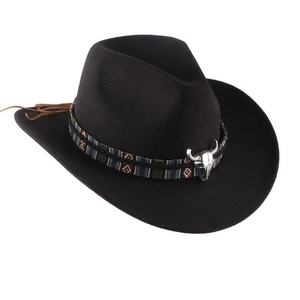 Detail of western fedora hat featuring ethnic band and silver bull head metal buckle