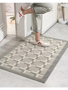 Macro view of gray and white checkered door mat with durable texture in home entryway