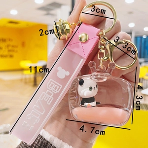 Panda acrylic liquid quicksand keychain with pink silicone wrist strap and golden bell