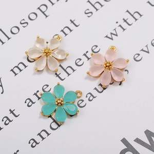 Detailed view of 18K gold-plated floral pendants with colorful zircon inlays