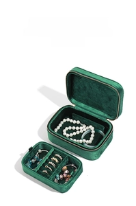 Detail view of the green velvet jewelry box with double-layer storage and ring slots