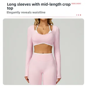 Detail of light pink long sleeve yoga top with white contrast trim and layered design