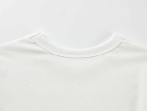 Close-up of the reinforced crew neck and fine stitching on a white modal sports T-shirt