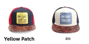 Flat brim baseball caps with yellow and blue labels and distressed leather texture