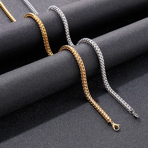 Close-up of gold and silver square dragon bone woven chains with lobster clasps