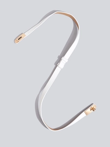 Detail view of a white leather thin waist belt featuring a polished gold metal twist lock