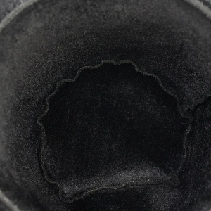 Close-up of black felt top hat interior showing detailed stitching and inner lining