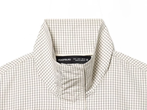 Detailed close-up of plaid nylon jacket collar with black and white grid pattern