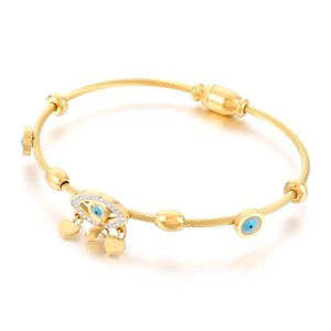 Gold evil eye open cuff bracelet with wire texture and dangling heart charms