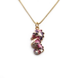 Gold plated seahorse pendant necklace with colorful enamel patterns on white background
