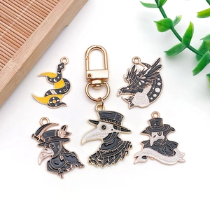 Gothic plague doctor and crow enamel charms set in black and gold for DIY jewelry