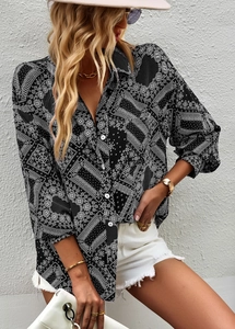 Close-up of black and white paisley print fabric on a stylish women's long sleeve shirt