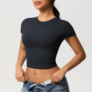 Close-up of a black slim-fit cropped sports t-shirt with high-elastic performance fabric