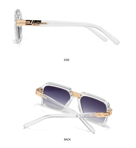 Detail view of transparent square frames with golden hollow metal hinges and temples
