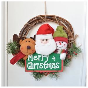 Close-up of a rustic rattan Christmas wreath with Santa, reindeer and snowman plush figures