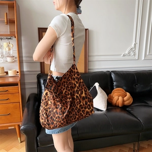 Chic leopard print canvas tote bag with large capacity shown in a stylish home setting