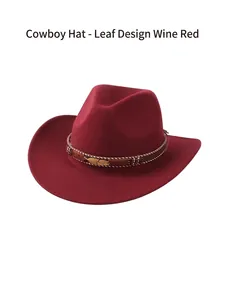 Close-up of wine red cowboy hat with woven band and decorative gold leaf ornaments
